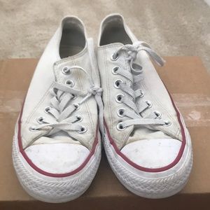 Chuck Taylor’s, white with red and blue trim